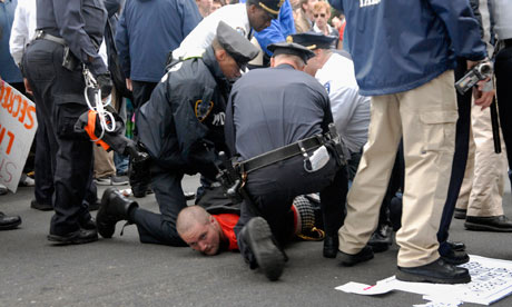 Police arrest a protester during Saturday's Occupy Wall Street march
