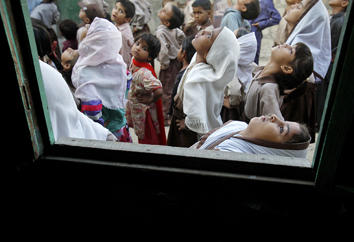 24 hours: Karachi, Pakistan: Students attend morning exercise before going to class