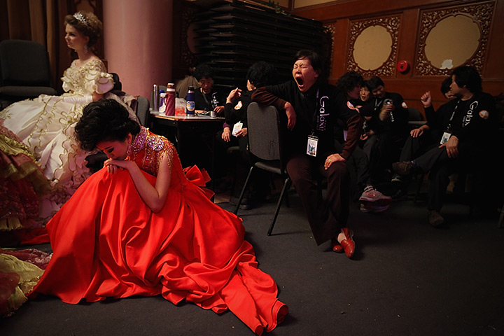 24 hours: Beijing, China: A model has a rest before Tsai Meiyue Wedding Dress 
