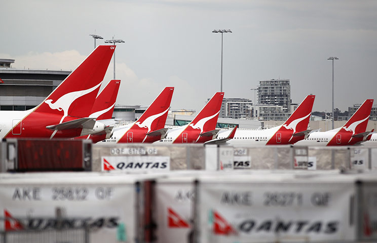 Qantas dispute: Qantas jets are grounded at the Qantas Domestic Terminal in Sydney