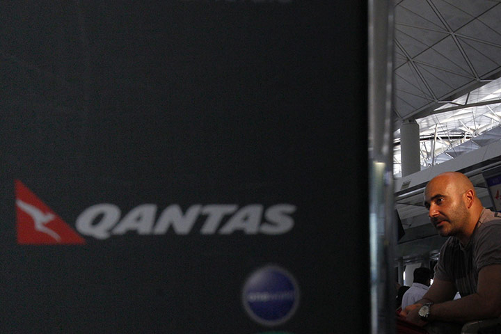 Qantas dispute: A stranded Qantas passenger waits at Hong Kong International Airport