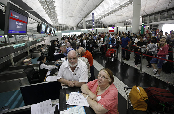 Qantas dispute: Stranded passengers wait for info at Hong Kong International Airport 