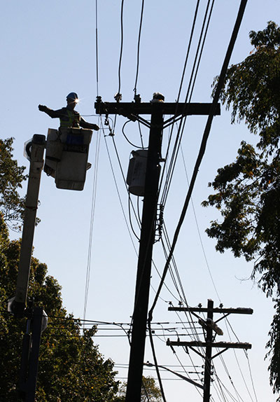 New York state snowstorm: An electric company worker repairs power lines in Larchmont