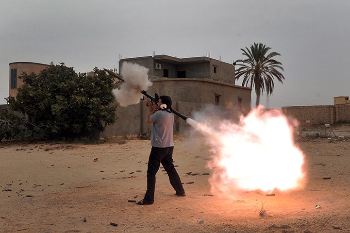 Sirte final assault: National Transitional Council fighters fire a rocket propelled grenade