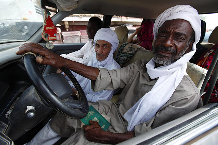 Sirte final assault: A family flees the fighting in Sirte at a checkpoint 