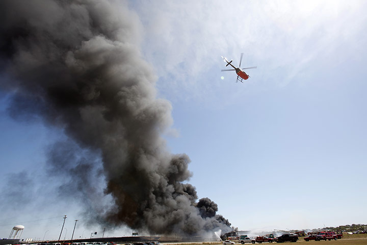24 hours in pictures: A helicopter flies over a burning chemical plant in Texas 