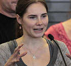 Amanda Knox addresses a news conference at Seattle airport after arriving home from Italy