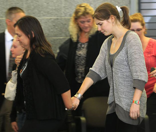 knox home: Amanda Knox leaves the Seattle press conference led by Edda Mellas