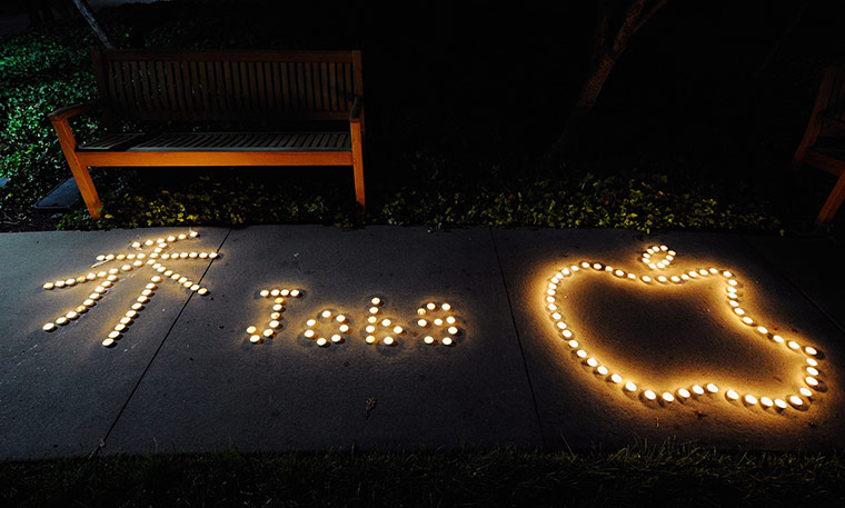 Steve Jobs Apple shrines: Cupertino, California: Students used candles to create the Apple logo