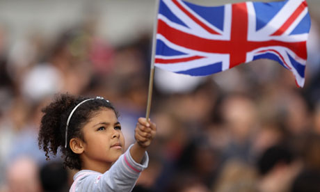 A young girl waves the Union flag