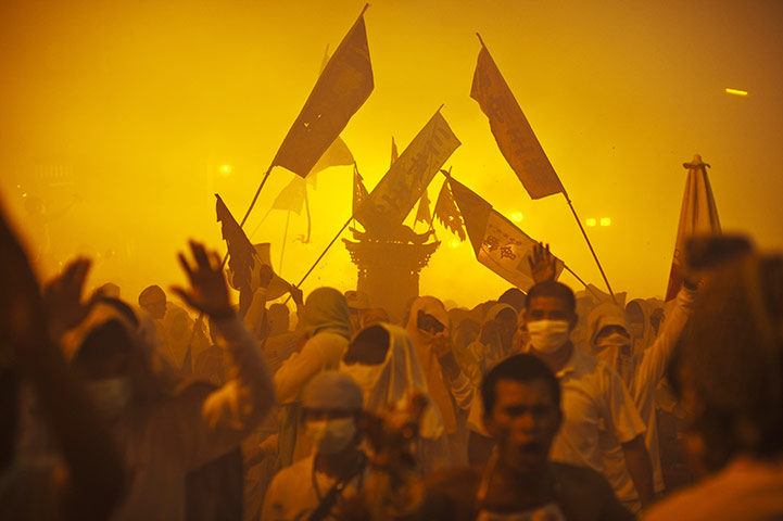 24 hours: Phuket, Thailand: Devotees of the Chinese shrine of Bang Neow