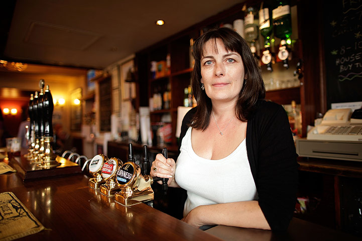 Week in Business: Publican Karen Murphy poses inside her pub The Red White & Blue
