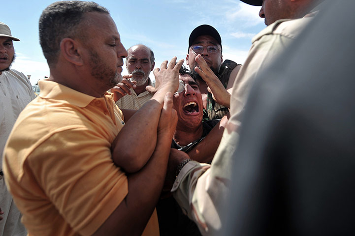 The battle for Sirte: A Libyan NTC fighter outside a field hospital near the frontline of Sirte