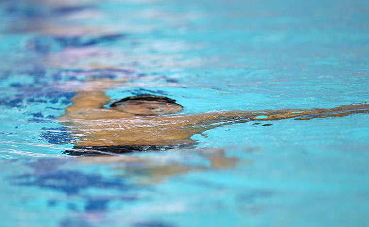Best of the week in Sport: Nelson Silva Jr in a men's 100m backstroke heat at the Swimming World Cup