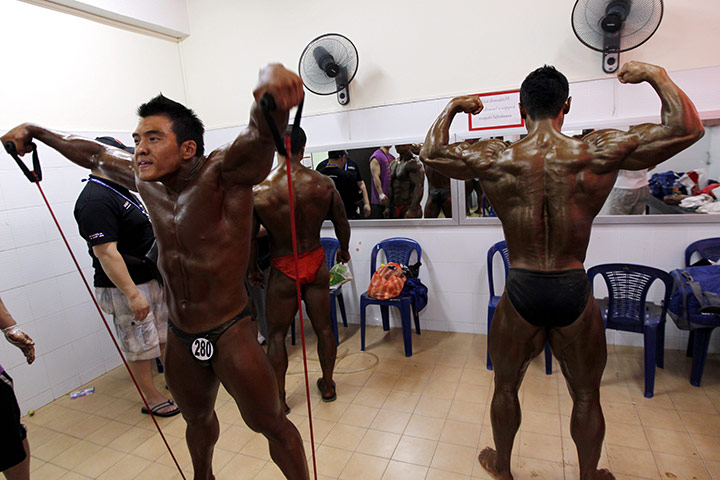 Bodybuilding: South Korea's Kim Jae Wook, left, and Jang Hee Seong train  backstage