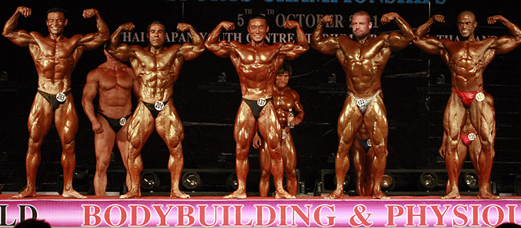 Bodybuilding: Competitors in the master 41-to-50-year-old category flex for the judges