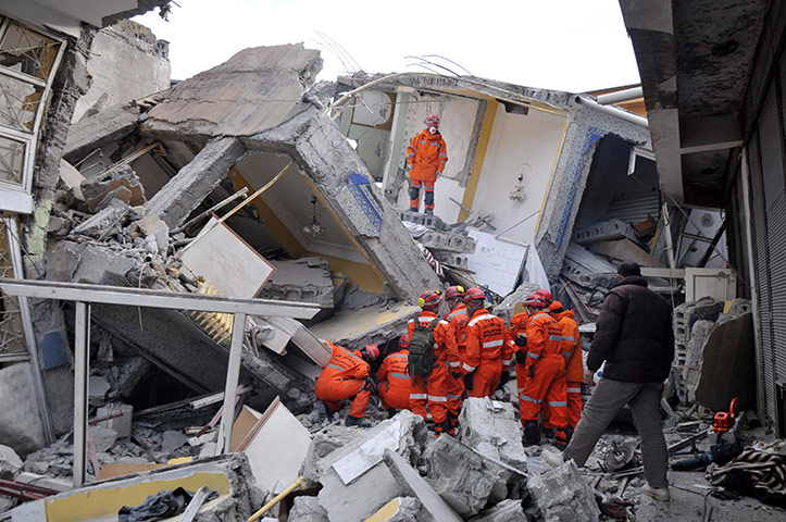 Turkey earthquake: Rescue workers try to release people from a collapsed building 