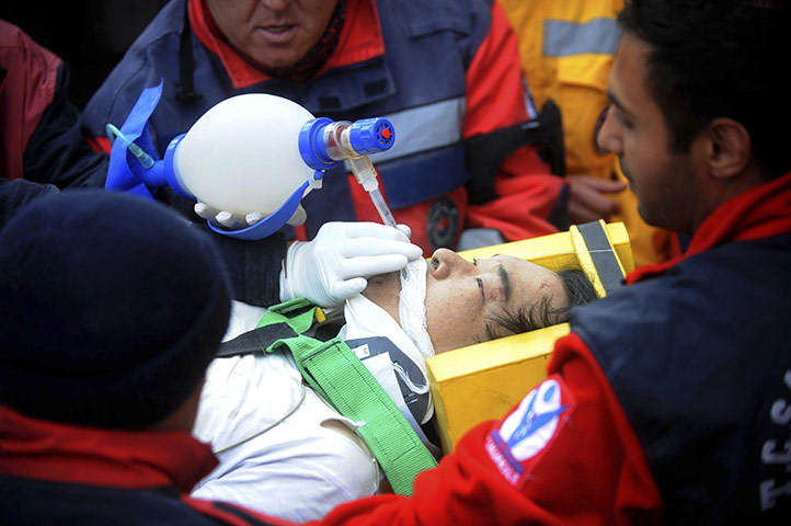 Turkey earthquake: Rescue workers carry earthquake survivor Atsushi Miyazaki in Van