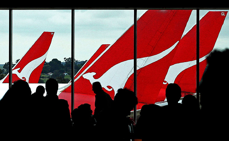 Week in Business: Passengers wait to board their Qantas flights at Melbourne