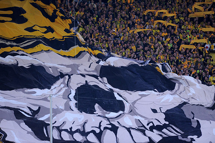 The week in sport: Dortmund fans with a giant skull flag