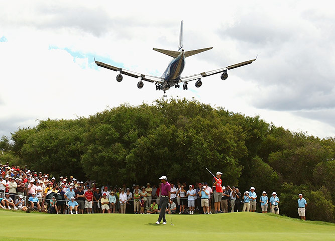 The week in sport: Tiger Woods prepares to putt on the 7th at the 2011 Australian Open