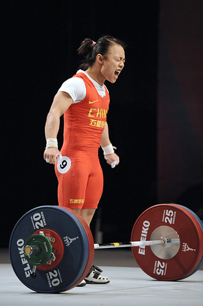 Week in sport: Tian Yuan celebrates after a clean and jerk lift of 117 kg