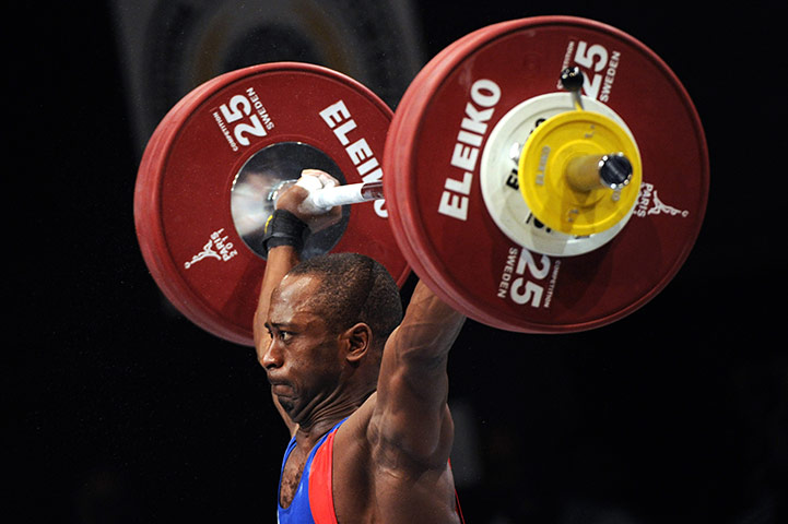 Weightlifting faces: France's Vencelas Dabaya Tientchieu - in the 69 kg men's weight class