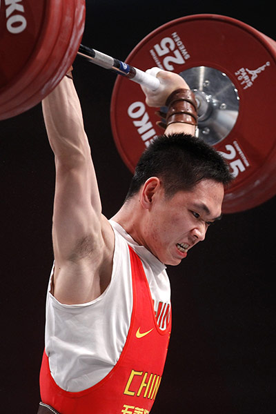 Weightlifting faces: China's Deshang Tang - men's 69kg weight class outside Paris