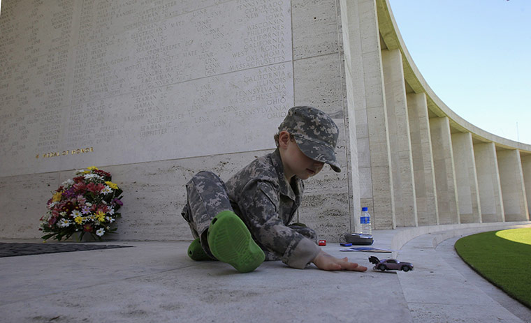 US Remembrance Day: David Price plays with his toy car in Taguig, Metro Manila
