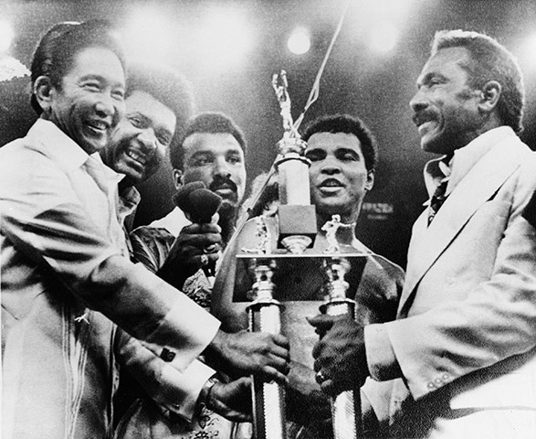 Thrilla in Manila: President Ferdinand Marcos presents the President's Trophy to Ali