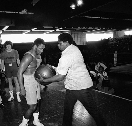 Thrilla in Manila: A trainer slams a medicine ball into Joe Frazier's abdomen during a workout