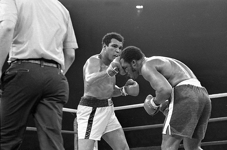 Thrilla in Manila: Muhammad Ali connects with the top of Joe Frazier's head in the 13th round