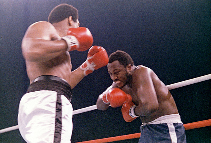 Thrilla in Manila: Frazier grimaces after Ali lands another left on his head 