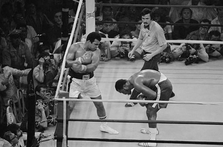 Thrilla in Manila: Joe Frazier ducks to avoid a swinging left from Ali during the 13th round