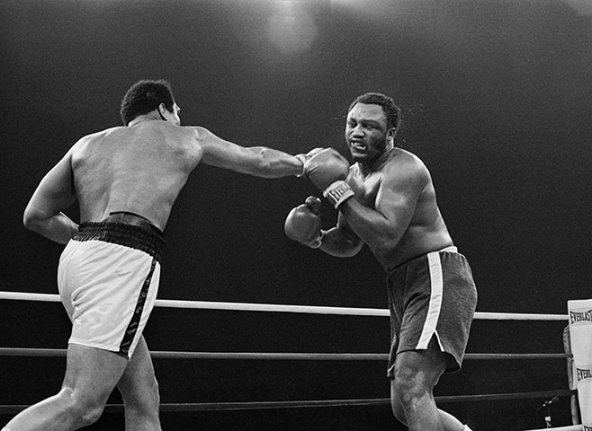 Thrilla in Manila: Joe Frazier's mouth is contorted after taking a hard right from Ali 