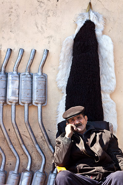 After the thaw: Azerbaijan: A street vendor waits for custom by the side of the road