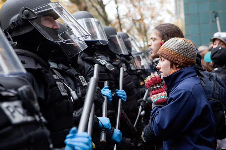 Occupy Portland: A protester pleads with police during a demonstration