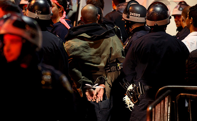 occupy wall street: a  protester is taken into custody by police