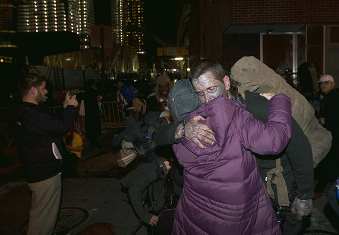 occupy wall street: Occupy Wall Street protestors embrace in New York