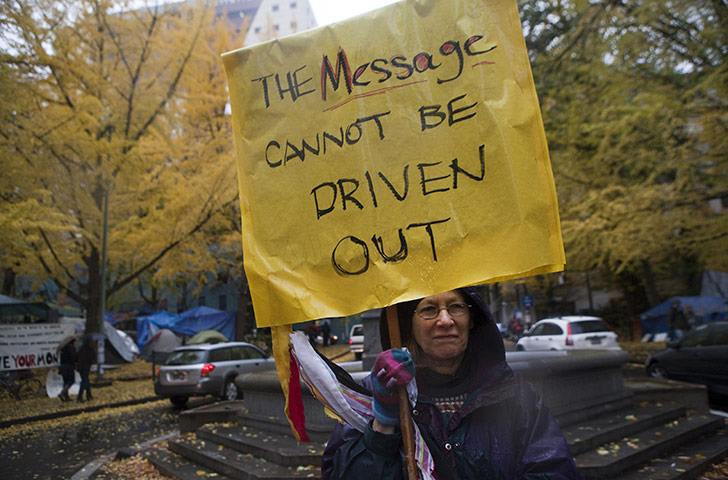 Occupy protest evictions: Portland, US: A demonstrator holds a sign