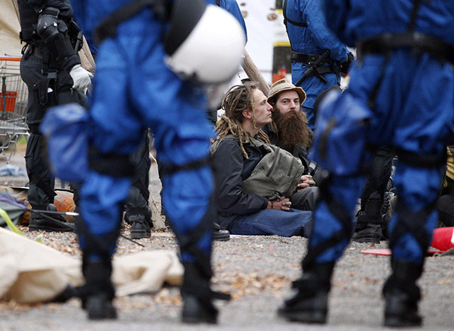 Occupy protest evictions: Zurich, Switzerland: Riot police surround protesters