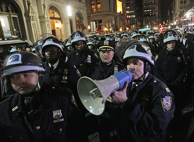 Occupy Wall St eviction: Police officers disperse protesters near the encampment