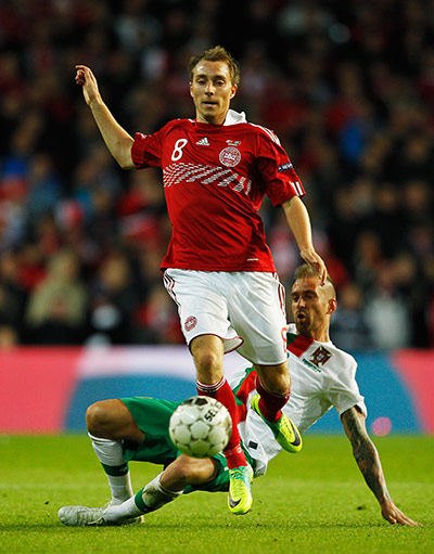 Euro 2012 qualifiers: Denmark's Christian Eriksen evades the challenge of Portugal's Meireles