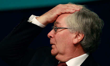 Bank of England Governor Mervyn King gestures after speaking during the TUC in Manchester