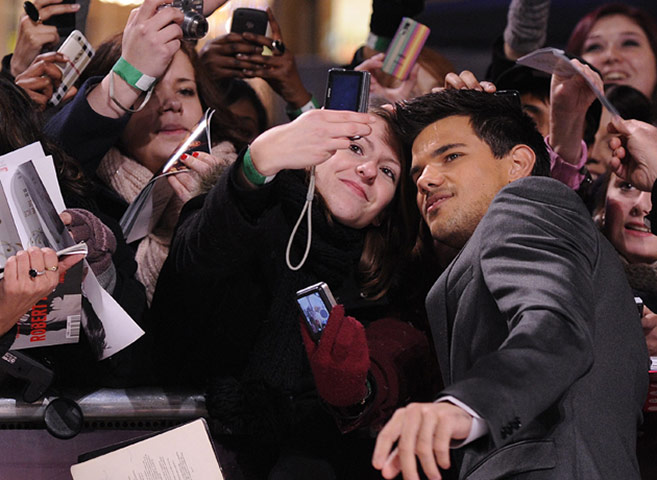 Twilight London premiere: Actors Lautner reacts as his photograph 