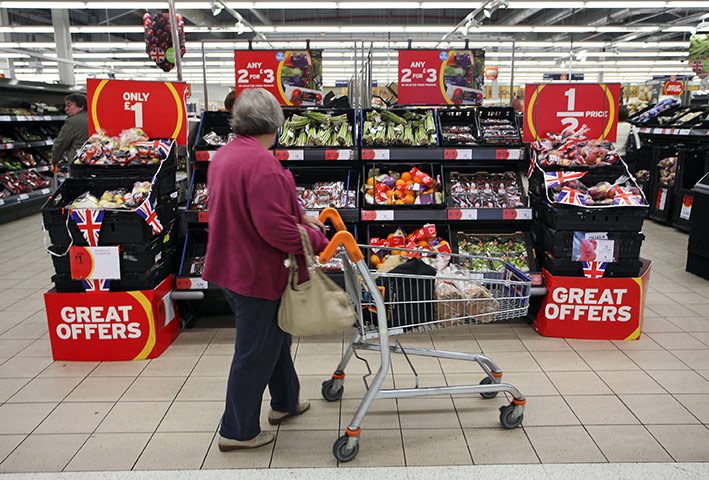 Week in business: A customer browses fruit and vegetable produce at a Sainsbury's supermarket