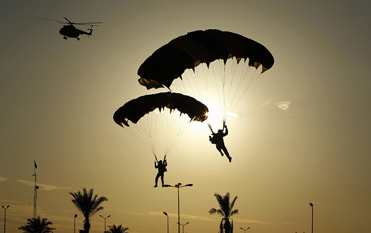 24 hours in pictures: Parachutists land at a rally in Tripoli