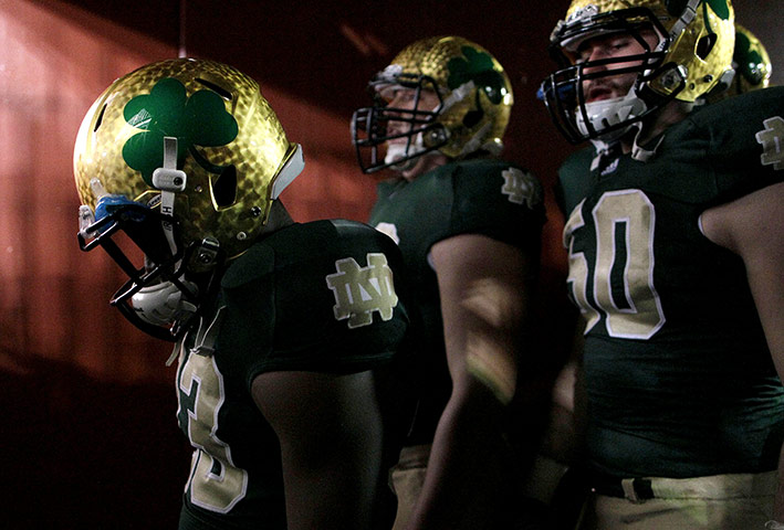 Sport pics of the week: Members of the Notre Dame football team walk out of a tunnel to the field 