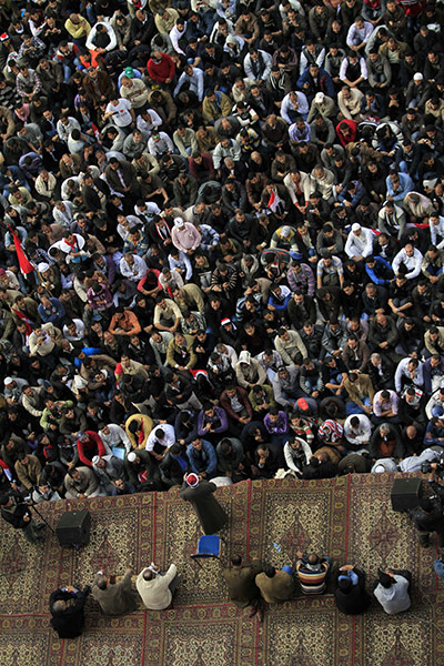 protests in cairo: Protesters listen to a sermon in Tahrir Square 