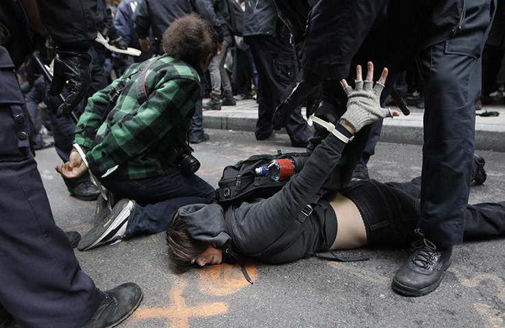 Occupy Day of Action: Police officers arrest a demonstrators at the Occupy Wall Street movement